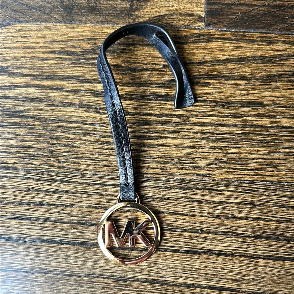 Michael Kors Black Strap with Gold Emblem bag tag
